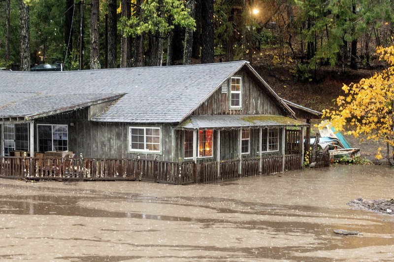 California Storms Vehicles make their way through a flooded area of High Street near Interstate 880 as rain falls in Oakland, Calif., on Sunday, Oct. 24, 2021. (Jane Tyska/Bay Area News Group via AP)