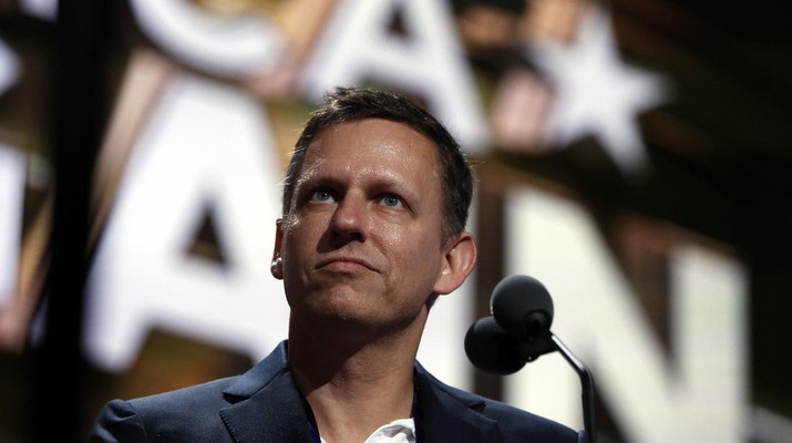 Billionaire tech investor Peter Thiel look overr the podium before the start of the second day session of the Republican National Convention in Cleveland, Tuesday, July 19, 2016. (AP Photo/Carolyn Kaster)
