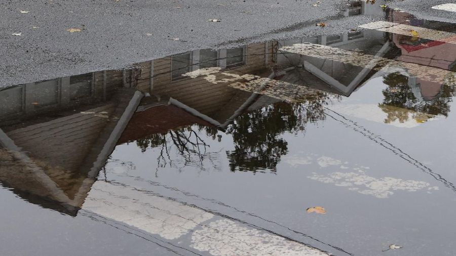 Flooded cars are pictured on a street as heavy rain moved into the northeast U.S. in Hoboken, New Jersey, U.S. October 26, 2021. REUTERS/Mike Segar
