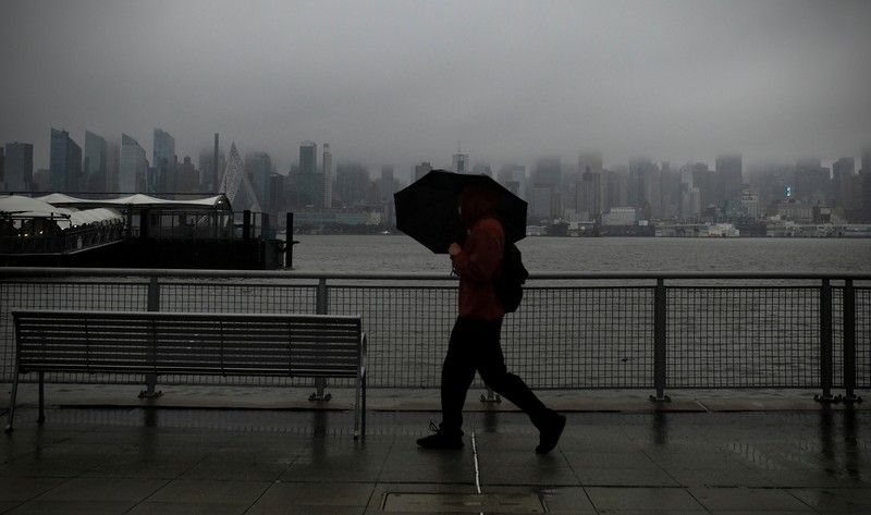 USA-WEATHER/ Flooded cars are pictured on a street as heavy rain moved into the northeast U.S. in Hoboken, New Jersey, U.S. October 26, 2021. REUTERS/Mike Segar