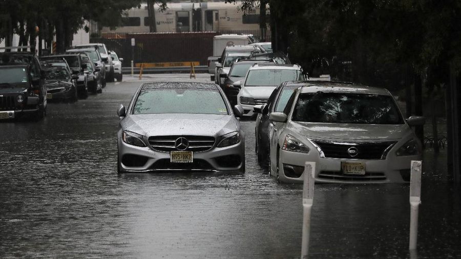 Flooded cars are pictured on a street as heavy rain moved into the northeast U.S. in Hoboken, New Jersey, U.S. October 26, 2021. REUTERS/Mike Segar