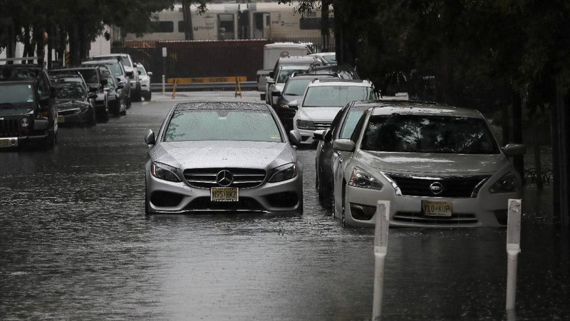 Flooded cars are pictured on a street as heavy rain moved into the northeast U.S. in Hoboken, New Jersey, U.S. October 26, 2021. REUTERS/Mike Segar