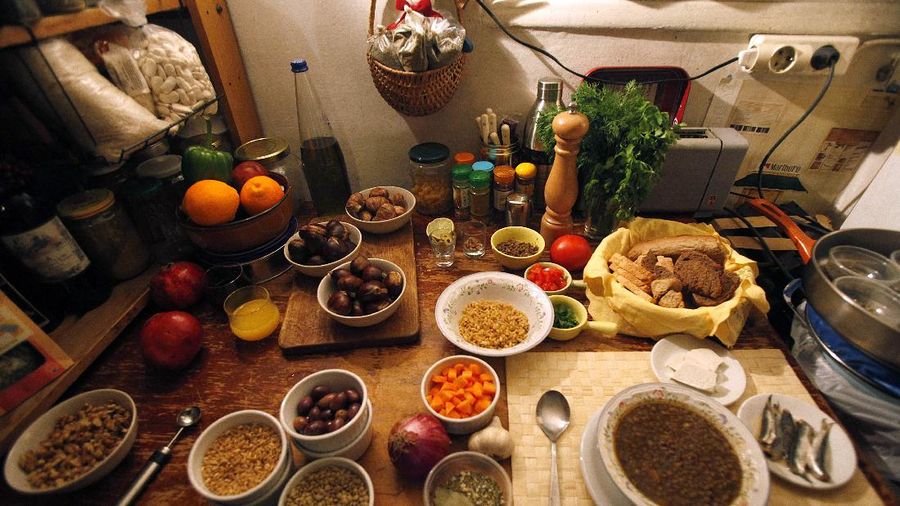 In this photo taken Saturday, Nov. 26, 2011, low-cost ingredients prepared by cooking TV show host F. T. Bletsas are displayed at his Athens home, during an interview for the Associated Press in Athens. Recession-hit Greeks have turned to cookbooks for low-cost meals, with bargain-hunting and frugal living entering the country's popular culture. (AP Photo/Kostas Tsironis)