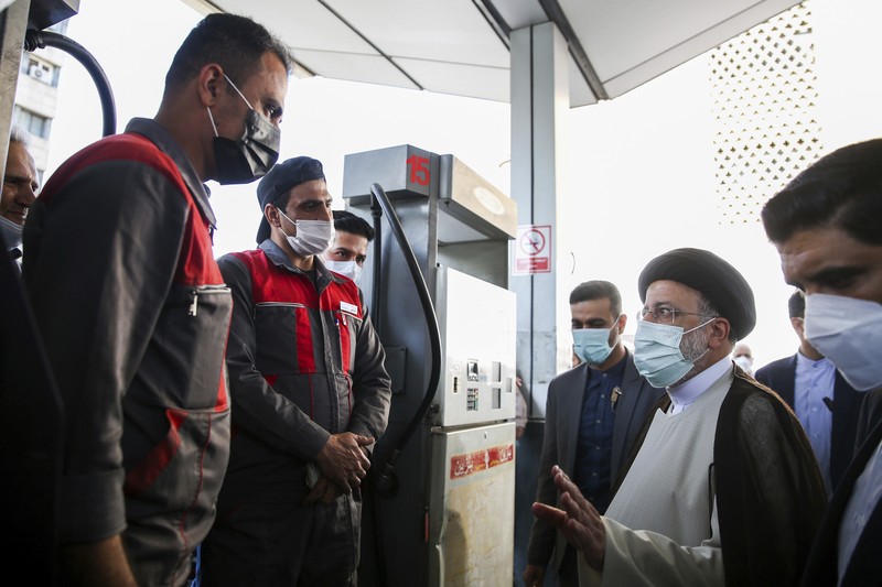 People fill their cars at a gas station in Tehran, Iran Wednesday, Oct. 27, 2021. Iran's President Ebrahim Raisi said Wednesday that a cyberattack which paralyzed every gas station in the Islamic Republic was designed to get 