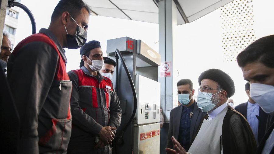 People fill their cars at a gas station in Tehran, Iran Wednesday, Oct. 27, 2021. Iran's President Ebrahim Raisi said Wednesday that a cyberattack which paralyzed every gas station in the Islamic Republic was designed to get 