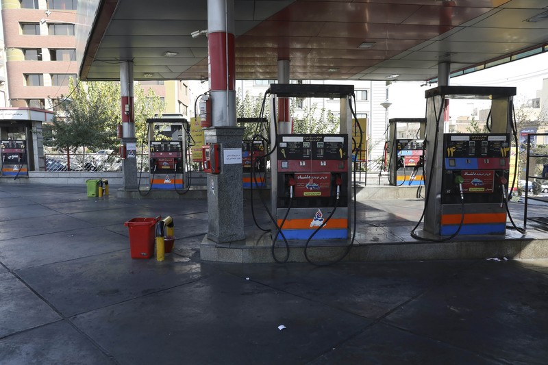 Iran People fill their cars at a gas station in Tehran, Iran Wednesday, Oct. 27, 2021. Iran's President Ebrahim Raisi said Wednesday that a cyberattack which paralyzed every gas station in the Islamic Republic was designed to get