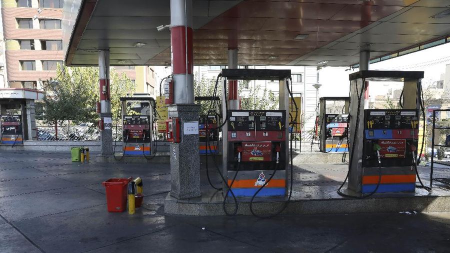 People fill their cars at a gas station in Tehran, Iran Wednesday, Oct. 27, 2021. Iran's President Ebrahim Raisi said Wednesday that a cyberattack which paralyzed every gas station in the Islamic Republic was designed to get 