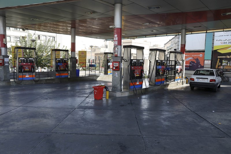 Iran People fill their cars at a gas station in Tehran, Iran Wednesday, Oct. 27, 2021. Iran's President Ebrahim Raisi said Wednesday that a cyberattack which paralyzed every gas station in the Islamic Republic was designed to get