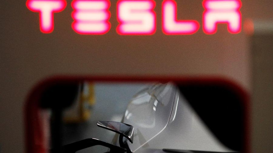 A Tesla car charges at a Supercharger station in Singapore October 22, 2021. Picture taken October 22, 2021. REUTERS/Edgar Su