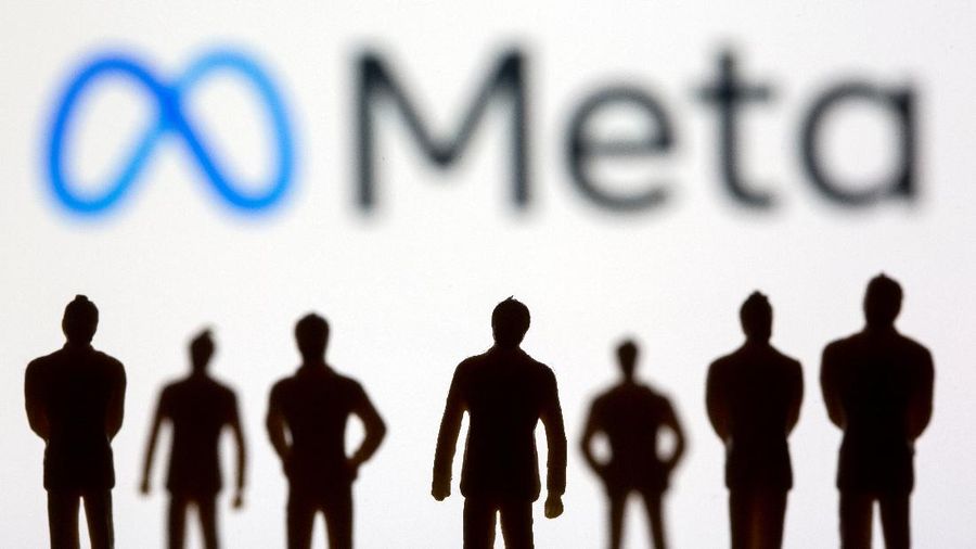 Small toy figures are seen in front of displayed Facebook's new rebrand logo Meta in this illustration taken, October 28, 2021. REUTERS/Dado Ruvic/Illustration