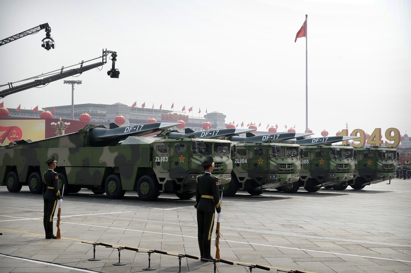 Chinese military vehicles carrying DF-17 ballistic missiles roll during a parade to commemorate the 70th anniversary of the founding of Communist China in Beijing, Tuesday, Oct. 1, 2019. Trucks carrying weapons including a nuclear-armed missile designed to evade U.S. defenses rumbled through Beijing as the Communist Party celebrated its 70th anniversary in power with a parade Tuesday that showcased China's ambition as a rising global force. (AP Photo/Mark Schiefelbein)