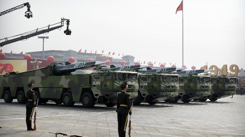 Chinese military vehicles carrying DF-17 ballistic missiles roll during a parade to commemorate the 70th anniversary of the founding of Communist China in Beijing, Tuesday, Oct. 1, 2019. Trucks carrying weapons including a nuclear-armed missile designed to evade U.S. defenses rumbled through Beijing as the Communist Party celebrated its 70th anniversary in power with a parade Tuesday that showcased China's ambition as a rising global force. (AP Photo/Mark Schiefelbein)