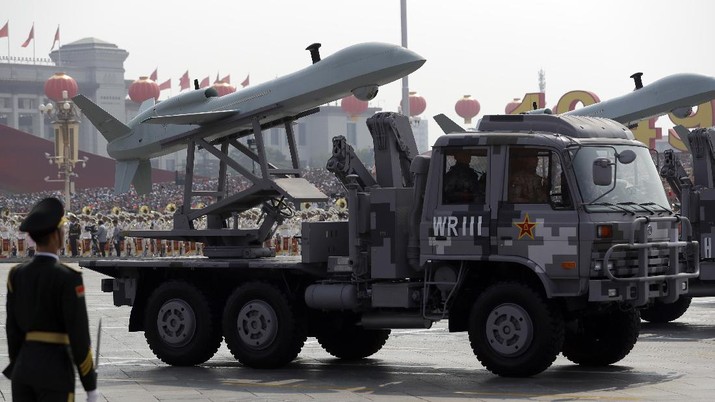 China 70 Years A Chinese military truck carrying an aerial vehicle rolls during a parade to commemorate the 70th anniversary of the founding of Communist China in Beijing, Tuesday, Oct. 1, 2019. Trucks carrying weapons including a nuclear-armed missile designed to evade U.S. defenses rumbled through Beijing as the Communist Party celebrated its 70th anniversary in power with a parade Tuesday that showcased China's ambition as a rising global force. (AP Photo/Mark Schiefelbein)