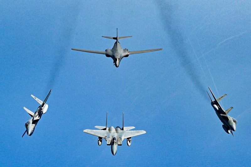 In this photo released by the U.S. Air Force, F-16s flown by the Egyptian Air Force break away from a U.S. Air Force B-1B Lancer over Egypt Saturday, Oct. 30, 2021. The U.S. Air Force said Sunday it flew a B-1B strategic bomber over key maritime chokepoints in the Mideast with allies including Israel amid ongoing tensions with Iran as its nuclear deal with world powers remains in tatters. (U.S. Air Force/Senior Airman Jerreht Harris via AP)