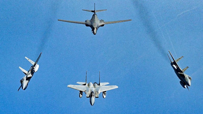 In this photo released by the U.S. Air Force, F-16s flown by the Egyptian Air Force break away from a U.S. Air Force B-1B Lancer over Egypt Saturday, Oct. 30, 2021. The U.S. Air Force said Sunday it flew a B-1B strategic bomber over key maritime chokepoints in the Mideast with allies including Israel amid ongoing tensions with Iran as its nuclear deal with world powers remains in tatters. (U.S. Air Force/Senior Airman Jerreht Harris via AP)
