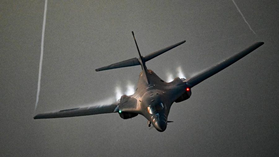 In this photo released by the U.S. Air Force, F-16s flown by the Egyptian Air Force break away from a U.S. Air Force B-1B Lancer over Egypt Saturday, Oct. 30, 2021. The U.S. Air Force said Sunday it flew a B-1B strategic bomber over key maritime chokepoints in the Mideast with allies including Israel amid ongoing tensions with Iran as its nuclear deal with world powers remains in tatters. (U.S. Air Force/Senior Airman Jerreht Harris via AP)