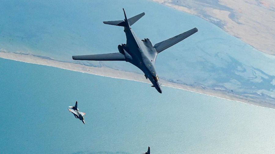 In this photo released by the U.S. Air Force, F-16s flown by the Egyptian Air Force break away from a U.S. Air Force B-1B Lancer over Egypt Saturday, Oct. 30, 2021. The U.S. Air Force said Sunday it flew a B-1B strategic bomber over key maritime chokepoints in the Mideast with allies including Israel amid ongoing tensions with Iran as its nuclear deal with world powers remains in tatters. (U.S. Air Force/Senior Airman Jerreht Harris via AP)