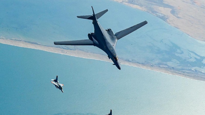 In this photo released by the U.S. Air Force, F-16s flown by the Egyptian Air Force break away from a U.S. Air Force B-1B Lancer over Egypt Saturday, Oct. 30, 2021. The U.S. Air Force said Sunday it flew a B-1B strategic bomber over key maritime chokepoints in the Mideast with allies including Israel amid ongoing tensions with Iran as its nuclear deal with world powers remains in tatters. (U.S. Air Force/Senior Airman Jerreht Harris via AP)