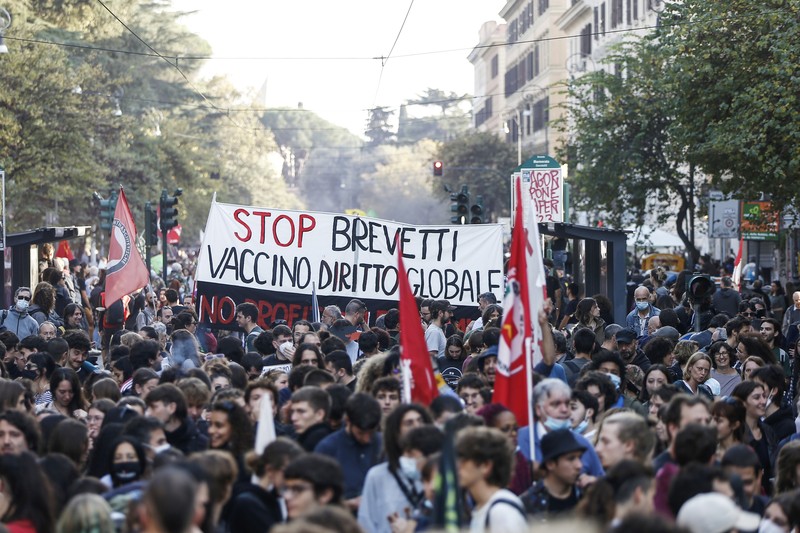 Italian Police remove climate activists trying to block traffic in front of the Italian Ministry of the Ecological Transition in Rome's via Cristoforo Colombo, one of the main road leading to La Nuvola (the cloud) convention center where the G20 summit is taking place, Saturday, Oct. 30, 2021. (AP Photo/Luca Bruno)