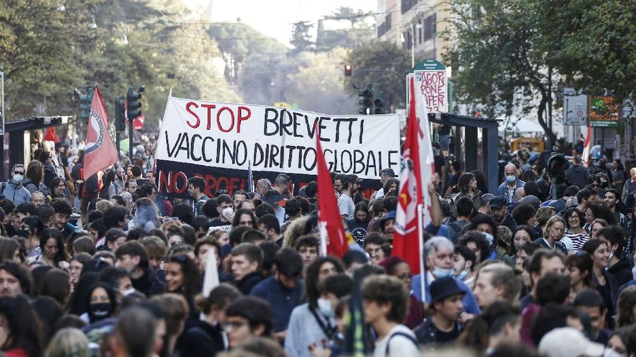 Italian Police remove climate activists trying to block traffic in front of the Italian Ministry of the Ecological Transition in Rome's via Cristoforo Colombo, one of the main road leading to La Nuvola (the cloud) convention center where the G20 summit is taking place, Saturday, Oct. 30, 2021. (AP Photo/Luca Bruno)