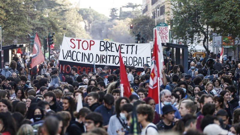 Italian Police remove climate activists trying to block traffic in front of the Italian Ministry of the Ecological Transition in Rome's via Cristoforo Colombo, one of the main road leading to La Nuvola (the cloud) convention center where the G20 summit is taking place, Saturday, Oct. 30, 2021. (AP Photo/Luca Bruno)