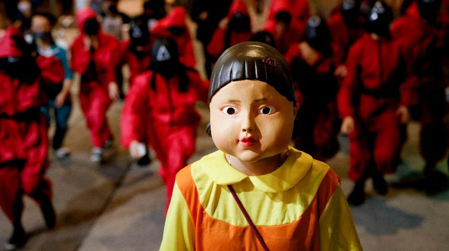 People wear Netflix series 'Squid Game' costumes celebrating Halloween, in Hong Kong, China, October 31, 2021. REUTERS/Tyrone Siu