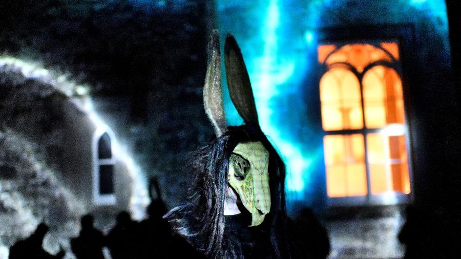 People wearing costumes wait in the rain to enter the Official Salem Witches' Halloween Ball in Salem, Massachusetts, U.S., October 30, 2021.   REUTERS/Reba Saldanha     TPX IMAGES OF THE DAY
