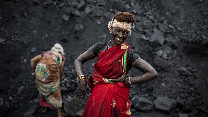 A man climbs a steep ridge with a basket of coal scavenged from a mine near Dhanbad, an eastern Indian city in Jharkhand state, Friday, Sept. 24, 2021. A 2021 Indian government study found that Jharkhand state -- among the poorest in India and the state with the nation’s largest coal reserves -- is also the most vulnerable Indian state to climate change. Efforts to fight climate change are being held back in part because coal, the biggest single source of climate-changing gases, provides cheap electricity and supports millions of jobs. It's one of the dilemmas facing world leaders gathered in Glasgow, Scotland this week in an attempt to stave off the worst effects of climate change. (AP Photo/Altaf Qadri)