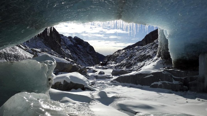 Ice coats a cave in the Eagle Glacier on Sunday, Feb. 14, 2021, in Juneau, Alaska. The glacier is remote, and one way to access it involves a 5.5 mile hike on a rugged trail to a public use cabin followed by lake crossings. (AP Photo/Becky Bohrer)