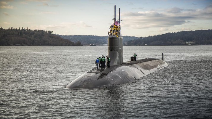 In this Dec. 15, 2016, photo, provided by the U.S. Navy, the Seawolf-class fast-attack submarine USS Connecticut (SSN 22) departs Puget Sound Naval Shipyard for sea trials following a maintenance availability. A Navy official says a submarine that collided with an unknown underwater object in the South China Sea has arrived in port at Guam. The Navy says the USS Connecticut was conducting routine operations when it struck the object on Oct. 2, 2021. (Thiep Van Nguyen II/U.S. Navy via AP)