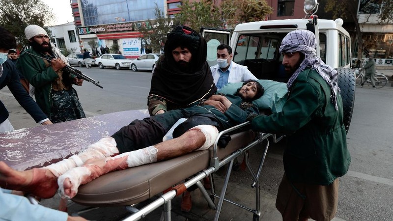 Taliban fighters block roads after an explosion Tuesday, Nov. 2, 2021. An explosion went off Tuesday at the entrance of a military hospital in Kabul, killing severa; people and wounding over a dozen, health officials said.(AP Photo/Ahmad Halabisaz)
