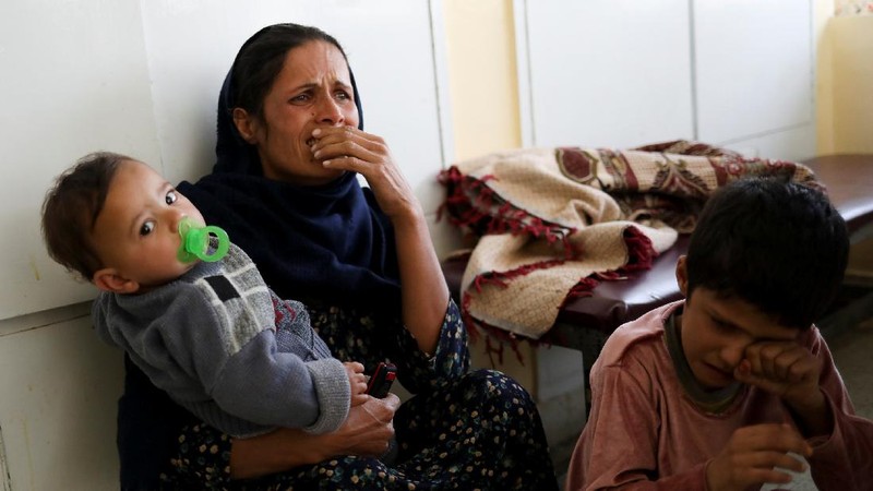 Taliban fighters block roads after an explosion Tuesday, Nov. 2, 2021. An explosion went off Tuesday at the entrance of a military hospital in Kabul, killing severa; people and wounding over a dozen, health officials said.(AP Photo/Ahmad Halabisaz)
