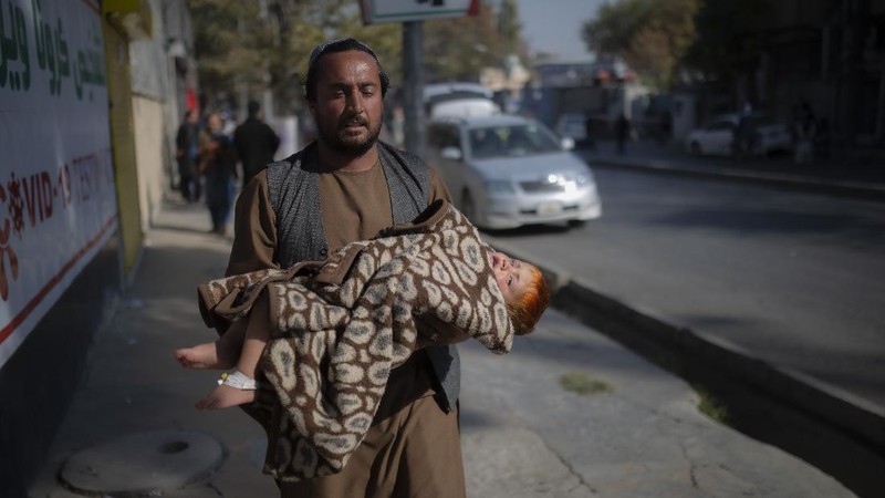 Taliban fighters block roads after an explosion Tuesday, Nov. 2, 2021. An explosion went off Tuesday at the entrance of a military hospital in Kabul, killing severa; people and wounding over a dozen, health officials said.(AP Photo/Ahmad Halabisaz)