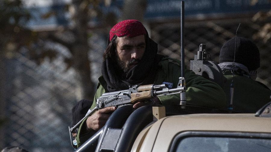 Taliban fighters block roads after an explosion Tuesday, Nov. 2, 2021. An explosion went off Tuesday at the entrance of a military hospital in Kabul, killing severa; people and wounding over a dozen, health officials said.(AP Photo/Ahmad Halabisaz)