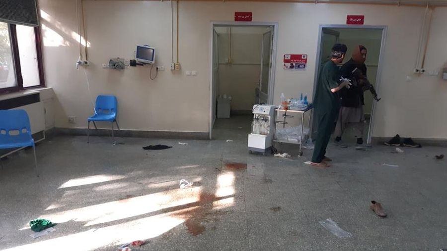 Taliban fighters block roads after an explosion Tuesday, Nov. 2, 2021. An explosion went off Tuesday at the entrance of a military hospital in Kabul, killing severa; people and wounding over a dozen, health officials said.(AP Photo/Ahmad Halabisaz)