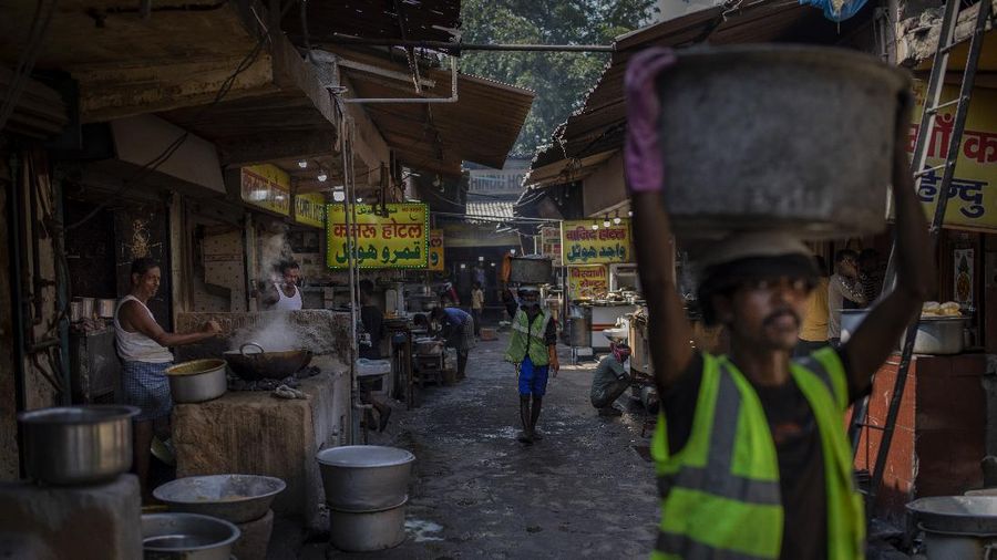 Restaurants along a food street use coal hearths in Dhanbad, an eastern Indian city in Jharkhand state, Saturday, Sept. 25, 2021. A 2021 Indian government study found that Jharkhand state -- among the poorest in India and the state with the nation’s largest coal reserves -- is also the most vulnerable Indian state to climate change. Efforts to fight climate change are being held back in part because coal, the biggest single source of climate-changing gases, provides cheap electricity and supports millions of jobs. It's one of the dilemmas facing world leaders gathered in Glasgow, Scotland this week in an attempt to stave off the worst effects of climate change. (AP Photo/Altaf Qadri)