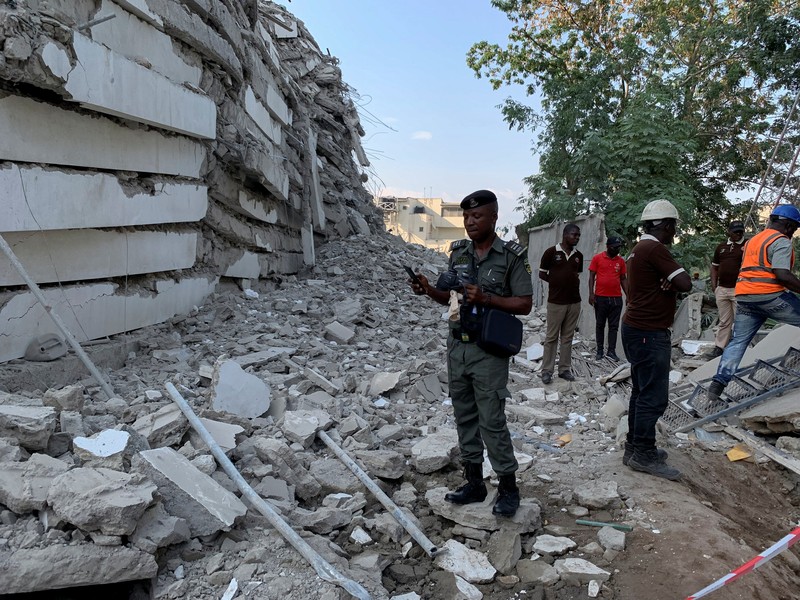 Emergency personnel stands by the debris of the collapsed building in Ikoyi, Lagos, Nigeria, November 1, 2021. Picture taken November 1, 2021. REUTERS/Nneka Chile