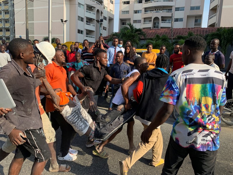 Emergency personnel stands by the debris of the collapsed building in Ikoyi, Lagos, Nigeria, November 1, 2021. Picture taken November 1, 2021. REUTERS/Nneka Chile