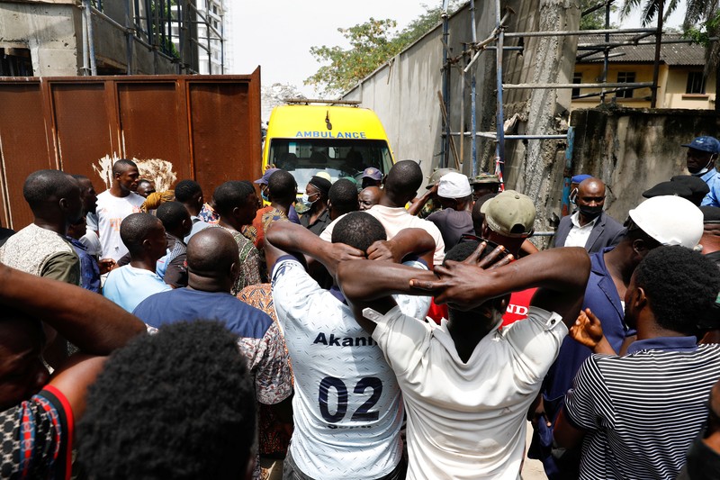 Emergency personnel stands by the debris of the collapsed building in Ikoyi, Lagos, Nigeria, November 1, 2021. Picture taken November 1, 2021. REUTERS/Nneka Chile