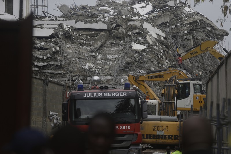 Emergency personnel stands by the debris of the collapsed building in Ikoyi, Lagos, Nigeria, November 1, 2021. Picture taken November 1, 2021. REUTERS/Nneka Chile
