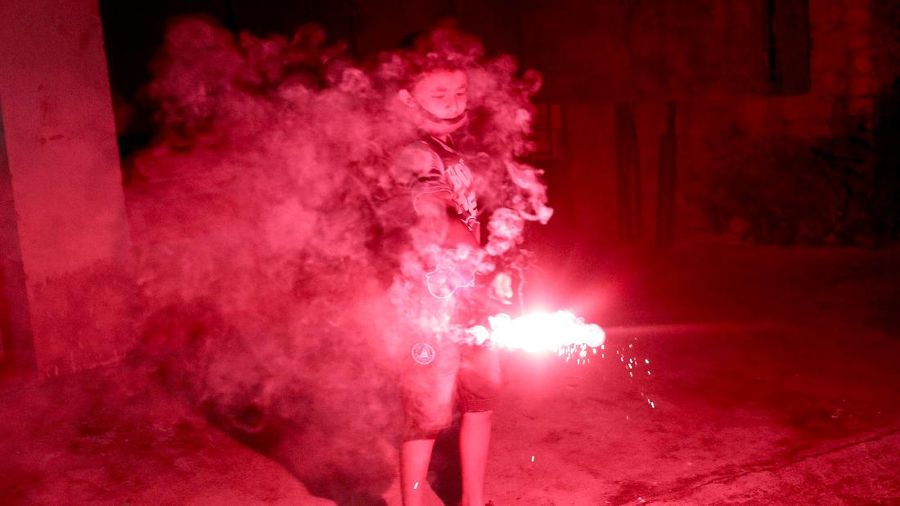 Residents light candles and fireworks on the rooftop of their house to celebrate Diwali, the festival of lights, in Kolkata, India, November 4, 2021. REUTERS/Rupak De Chowdhuri