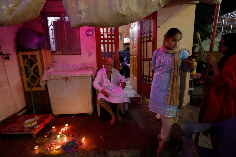 Residents light candles and fireworks on the rooftop of their house to celebrate Diwali, the festival of lights, in Kolkata, India, November 4, 2021. REUTERS/Rupak De Chowdhuri