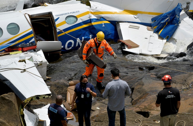 The wreckage of a small airplane that crashed with Brazilian country singer Marilia Mendonca on board, is seen near a waterfall area in Piedade de Caratinga, state of Minas Gerais, Brazil, November 6, 2021. REUTERS/Washington Alves