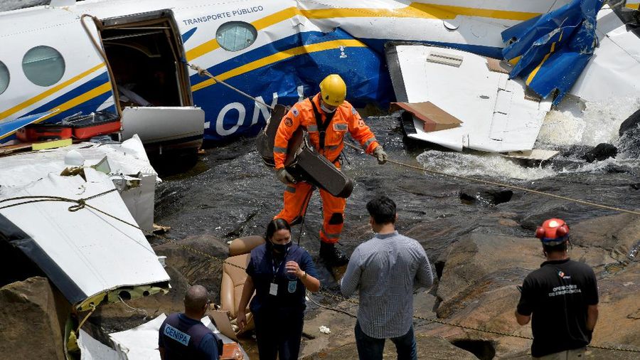 The wreckage of a small airplane that crashed with Brazilian country singer Marilia Mendonca on board, is seen near a waterfall area in Piedade de Caratinga, state of Minas Gerais, Brazil, November 6, 2021. REUTERS/Washington Alves