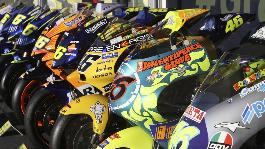 MotoGP rider Valentino Rossi of Italy sits in the team box during warmup before the Valencia Motorcycle Grand Prix, the last race of the season, at the Ricardo Tormo circuit in Cheste, near Valencia, Spain, Sunday, Nov. 14, 2021. Rossi will be retiring from MotoGP racing as the season ends in Valencia. (AP Photo/Alberto Saiz)