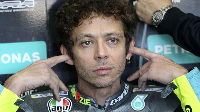 MotoGP rider Valentino Rossi of Italy sits in the team box during warmup before the Valencia Motorcycle Grand Prix, the last race of the season, at the Ricardo Tormo circuit in Cheste, near Valencia, Spain, Sunday, Nov. 14, 2021. Rossi will be retiring from MotoGP racing as the season ends in Valencia. (AP Photo/Alberto Saiz)