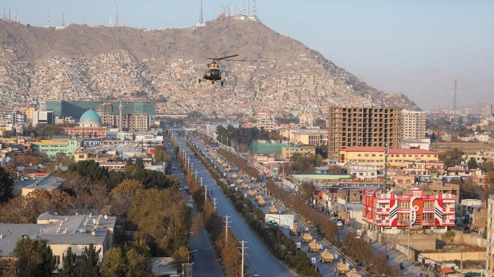 A military helicopter is pictured during the Taliban military parade in Kabul, Afghanistan November 14, 2021. REUTERS/Ali Khara NO RESALES. NO ARCHIVES