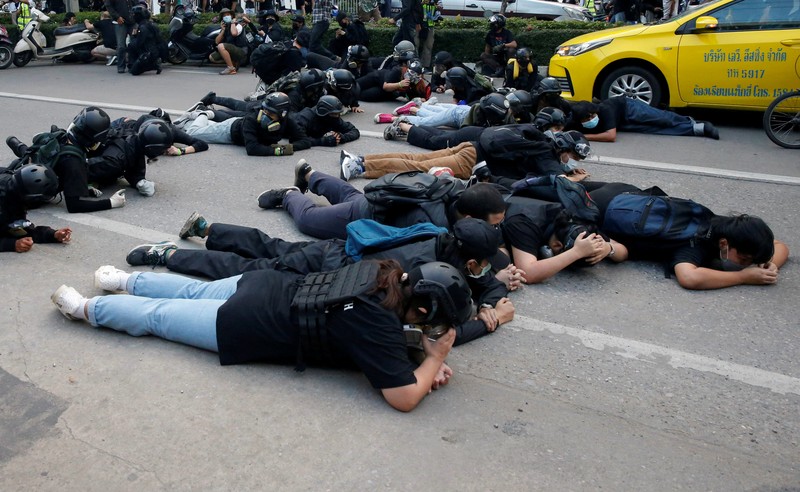 CORRECTS YEAR - Anti-government protesters hold banners calling for the monarchy reform marching to the German embassy in Bangkok, Thailand, Sunday, Nov. 14, 2021. Protesters calling for the reform of the monarchy returned to the streets of Bangkok despite the ruling of the Constitutional Court on Wednesday that such demands are tantamount to attempting to overthrow the system of government with the king as head of state. (AP Photo/Surat Sappakun)