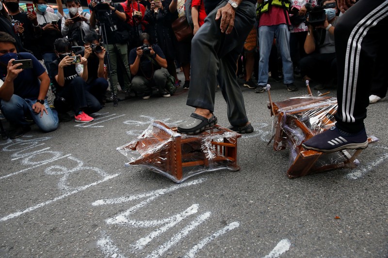 CORRECTS YEAR - Anti-government protesters hold banners calling for the monarchy reform marching to the German embassy in Bangkok, Thailand, Sunday, Nov. 14, 2021. Protesters calling for the reform of the monarchy returned to the streets of Bangkok despite the ruling of the Constitutional Court on Wednesday that such demands are tantamount to attempting to overthrow the system of government with the king as head of state. (AP Photo/Surat Sappakun)