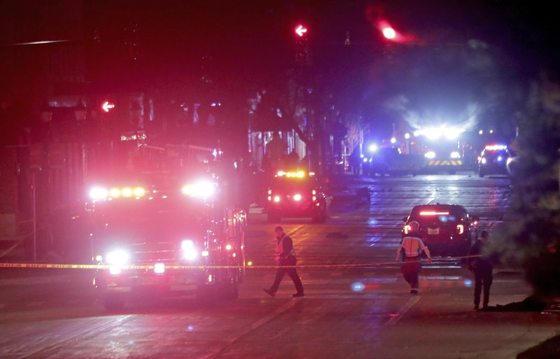 A red SUV speeds past attendees moments before plowing into a crowd at a Christmas parade in Waukesha, Wisconsin, U.S., in this still image taken from a November 21, 2021 social media video. CITY OF WAUKESHA/Facebook/via REUTERS THIS IMAGE HAS BEEN SUPPLIED BY A THIRD PARTY. MANDATORY CREDIT. NO RESALES. NO ARCHIVES.